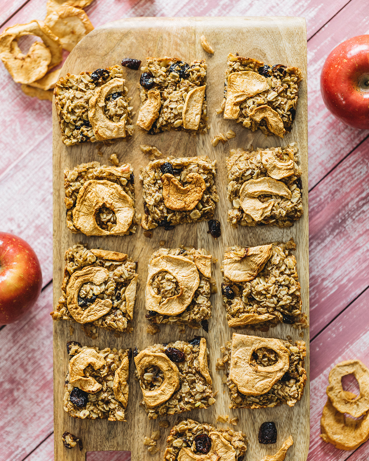 cranberry apple bars on a wood board