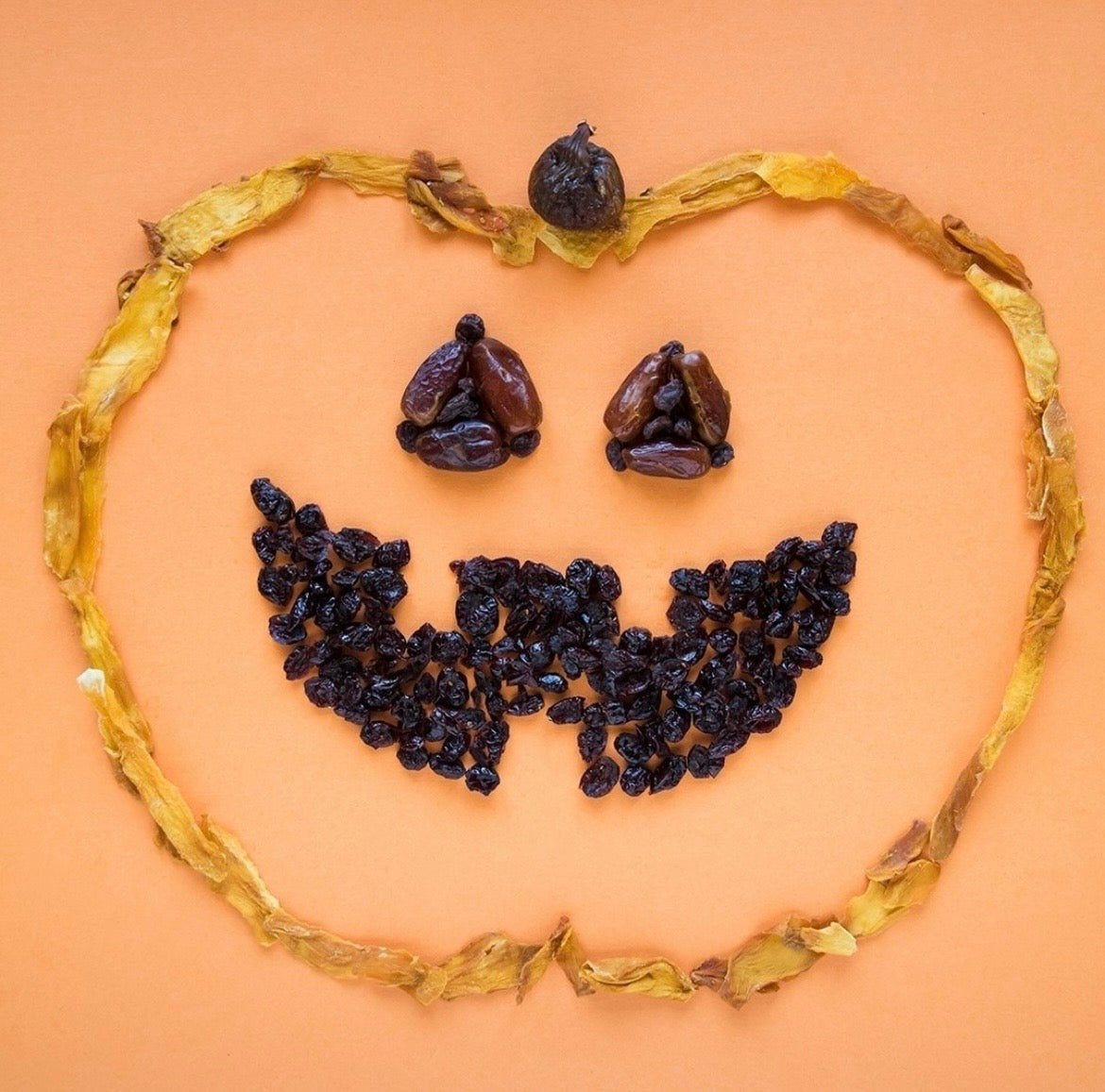 pumpkin face created with dried fruits