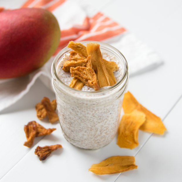 Seed pudding with dried mango on a white table.