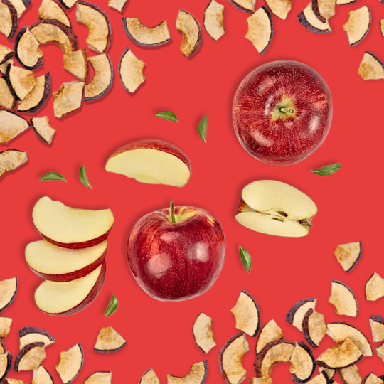 Dried and sliced apples on a red background